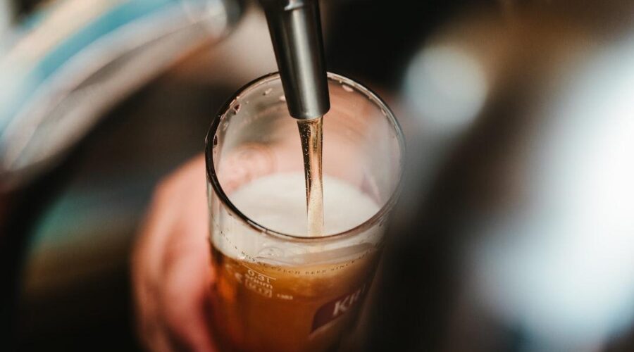 Craft beer being poured from a tap