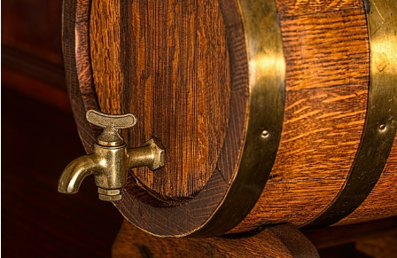 Close-up shot of an oak barrel for brewing stout beer.
