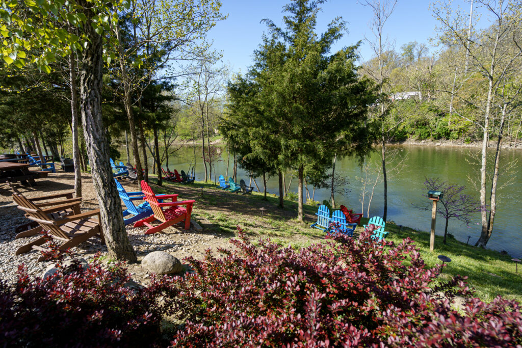 Adirondack chairs overlooking the Little Miami River beside the brewery, perfect for a post-ride break.