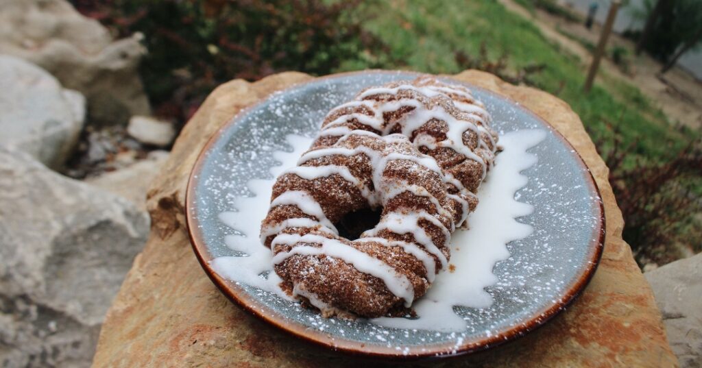 Oven-baked churro donuts coated in cinnamon sugar and drizzled with icing at LMBC.