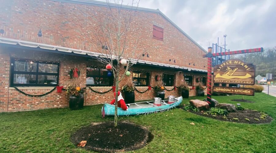 Exterior of Little Miami Brewing Company decorated for Thanksgiving, featuring warm lighting and seasonal outdoor décor.