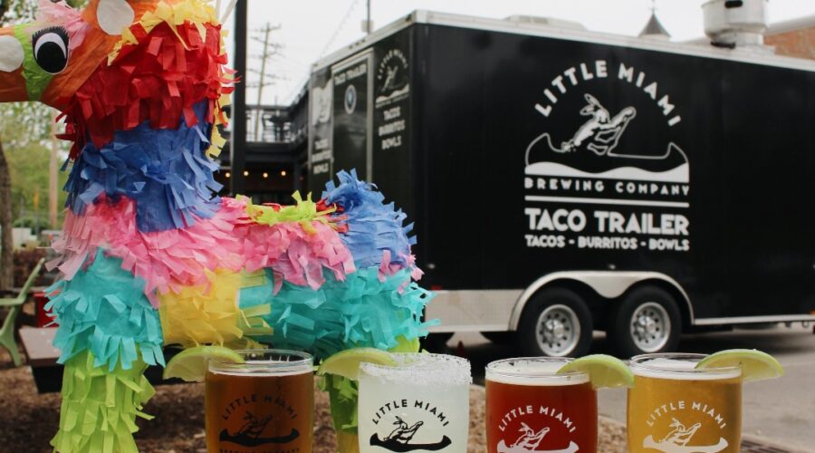 Little Miami Brewing Company’s diverse craft beers, including seasonal IPAs, with the Taco Trailer in the background.