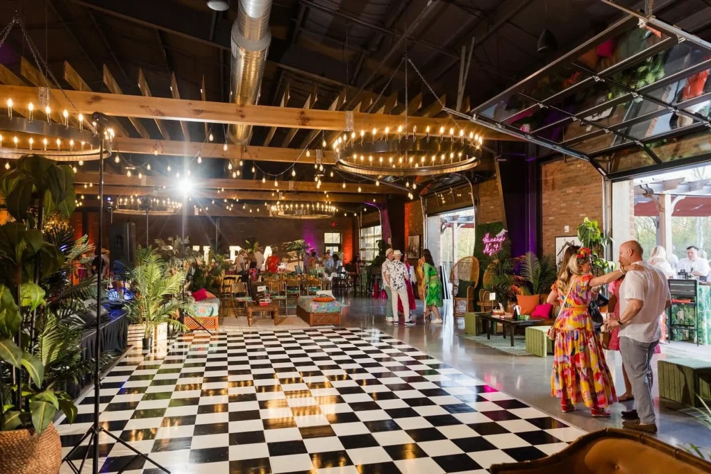 A spacious private event venue at Little Miami Brewing Company decorated for a milestone birthday party with tables, chairs, and festive décor.
